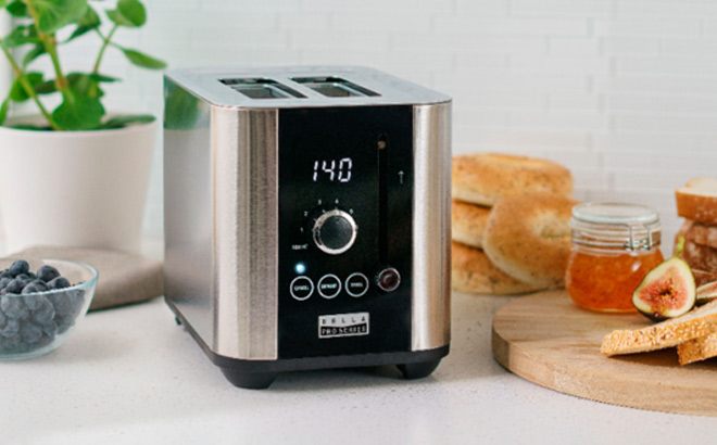 Bella Pro Digital Toaster on Table with Sandwiches on the side