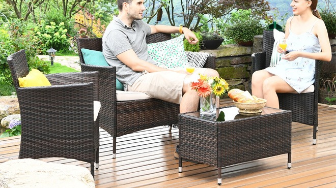 Couple Sitting on a Costway 8-Piece Patio Furniture Set 