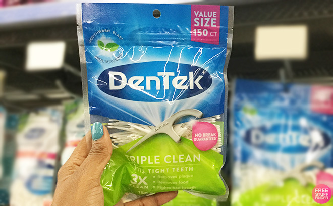 Hand Holding DenTek Triple Clean Advanced Clean Floss Picks