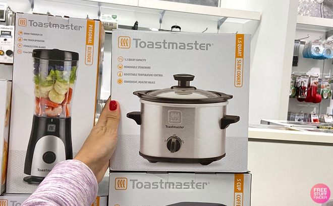 Hand Holding Toastmaster 1 5 Quart Stainless Steel Slow Cooker