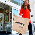 A Woman Exiting a Kohl's Store Carrying a Kohl's Shopping Bag