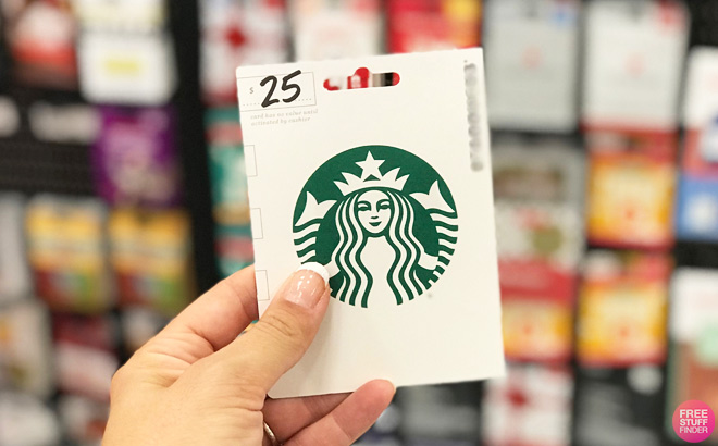 Hand Holding a $25 Starbucks Gift Card