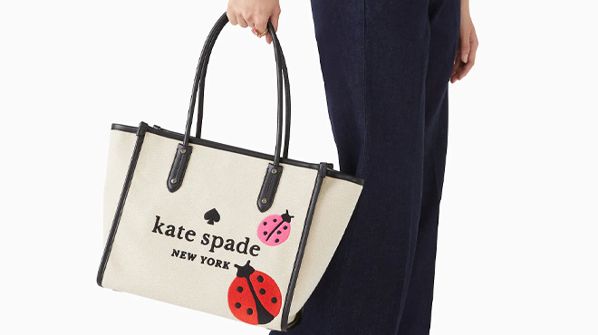 A Woman Carrying Kate Spade Ella Ladybug Tote Bag