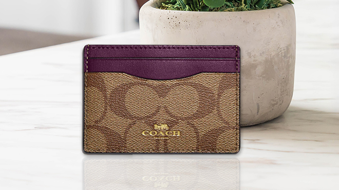 Coach Outlet Card Case In Signature Canvas on a Table