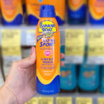 Hand Holding Banana Boat 50 SPF 6 Ounce Sport Sunscreen