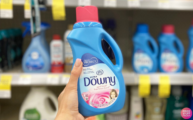 Hand Holding Downy Fabric Softener 40 Loads Inside Walgreens Store