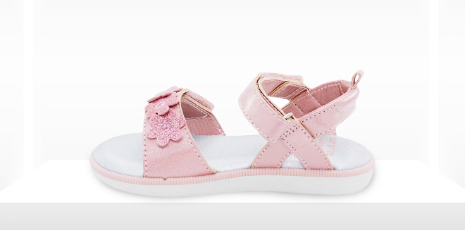 Stride Rite Pink Clarice Sandals on a Gray Background