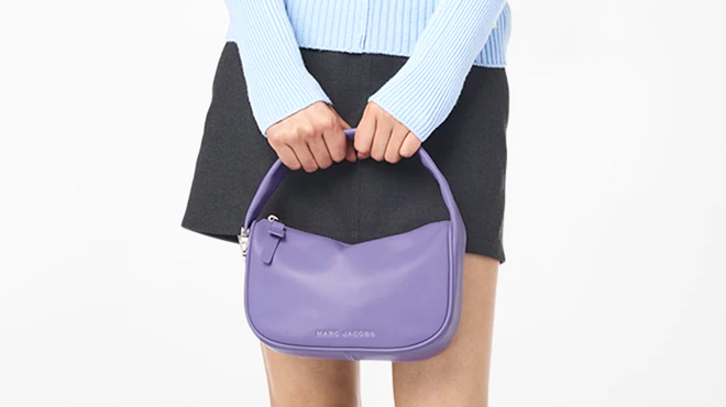 Woman Holding the Marc Jacobs The Pushlock Mini Hobo Bag