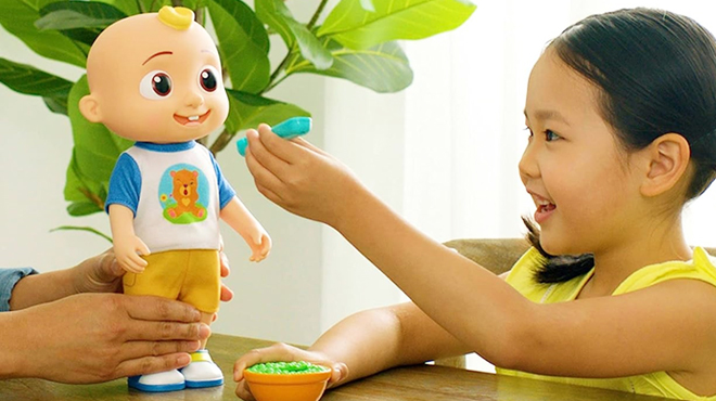 A Girl Playing with CoComelon Deluxe Interactive JJ Doll