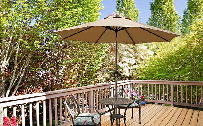 Blissun 9 Foot Outdoor Patio Umbrella with on a Table Set with Chairs Placed on Backyard Deck