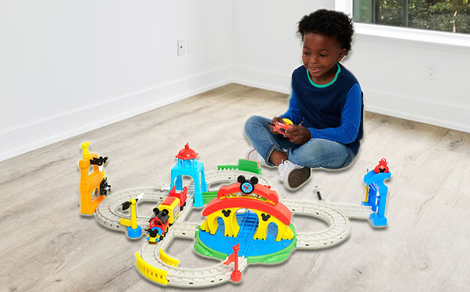 Boy Playing Disney Mickey Mouse Train Set