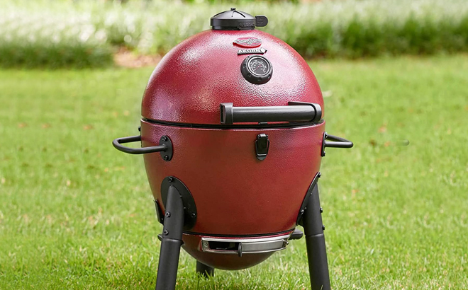 Char Griller Portable Kamado Charcoal Grill in Red Color on the Lawn