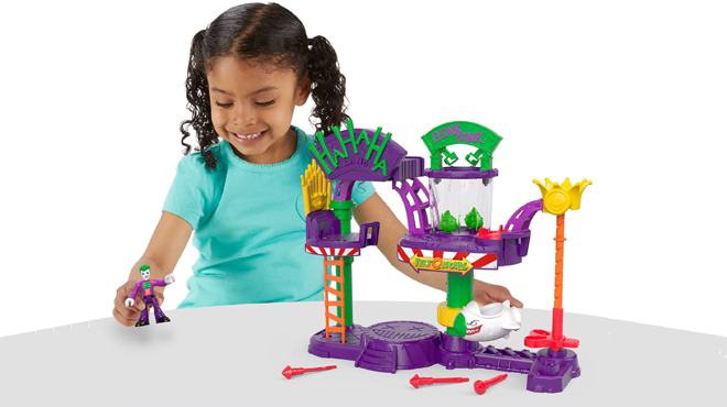 Child Playing Imaginext DC The Joker Laff Factory Playset