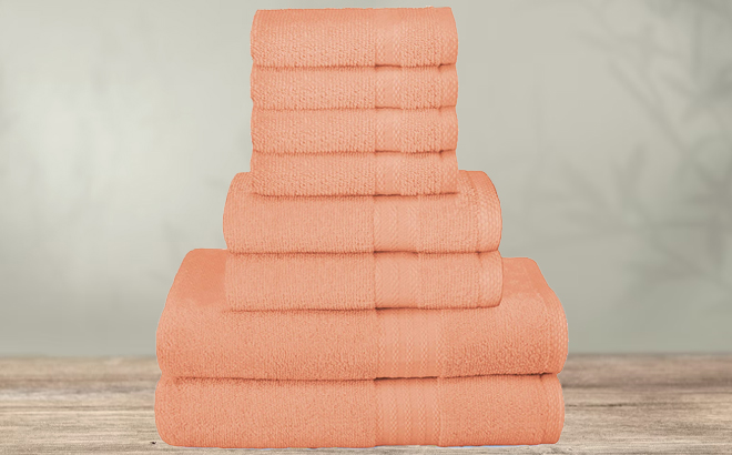 Glamburg Ultra Soft 8 Piece Peach Towel Set on a Table