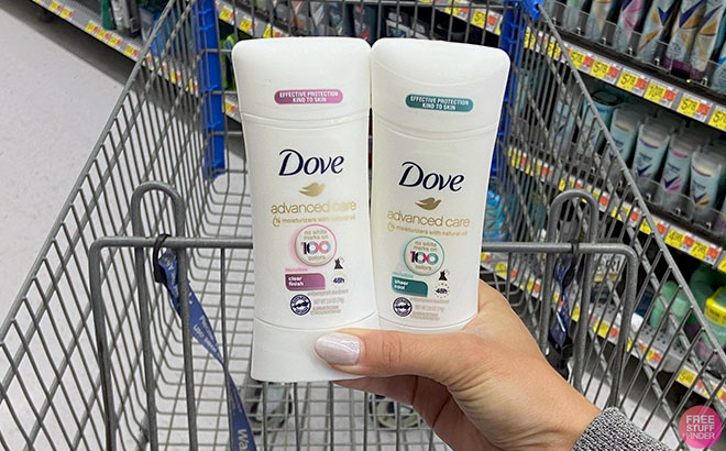 Hand Holding a Two Dove Advanced Care Deodorant 2 1