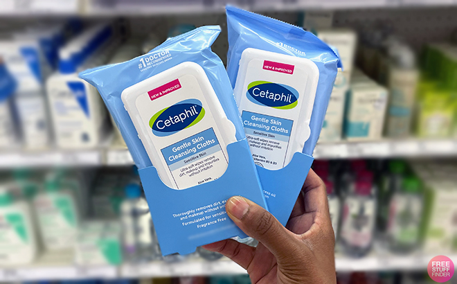 Hand holding 2 Pack of Cetaphil Face and Body Wipes