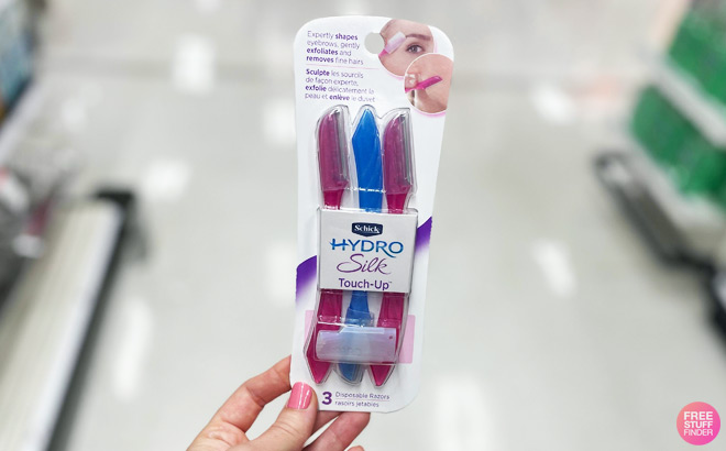 Handholding Schick Silk Razor