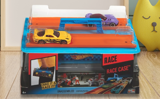 Hot Wheels Race Case with Two Cars in the Box on a Kids Room Floor