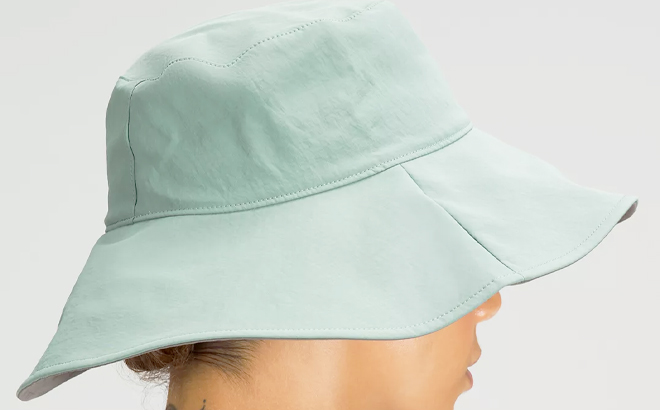 Lululemon Womens Wide Brim Logo Bucket Hat Tidewater Teal Color with Woman