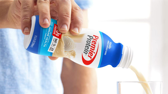 Man Pouring Premier Protein Shake Vanilla Flavor in a Glass