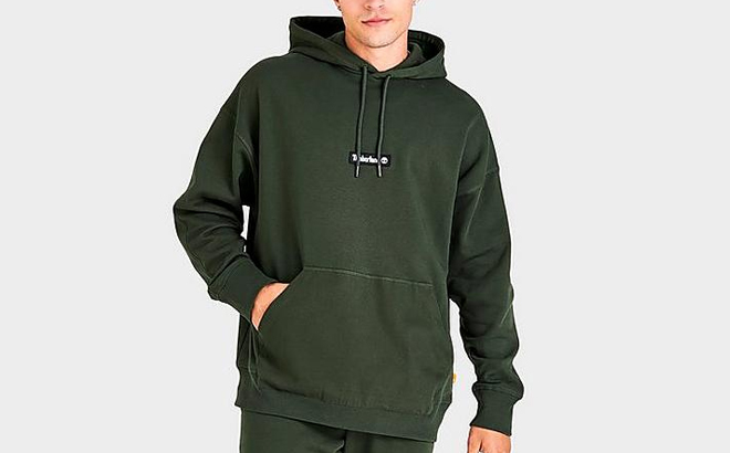 Man Wearing Timberland Cargo Pullover Hoodie in Green Color