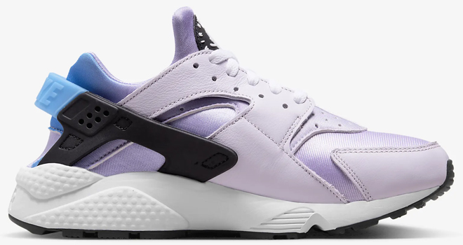 Nike Air Huarache Womens Shoe in Lilac Color on Gray Background