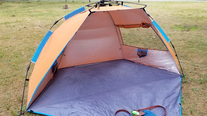 Oileus X Large 4 Person Beach Tent Sun Shelter in Orange Color on the Park