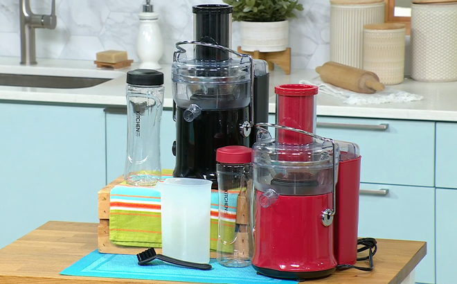 Two Kitchen HQ 2 Speed Power Juicers with Bottles on a Kitchen Island