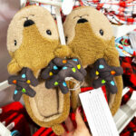 a Person Holding Wondershop Adult Holiday Light up Reindeer Slippers