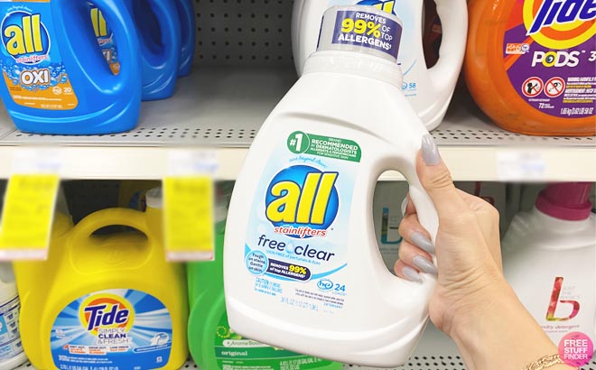 a Person Holding an All Liquid Laundry Detergent