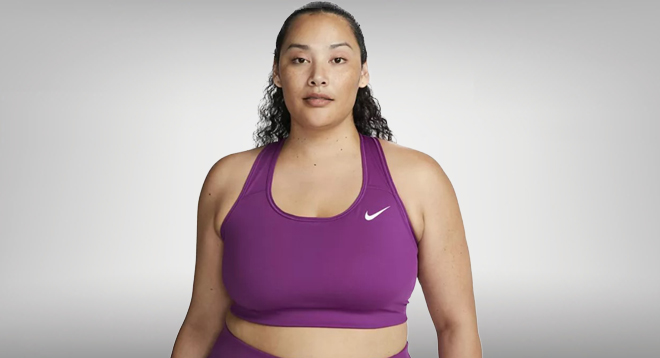 a Person Wearing a Nike Plus Size Dri Fit Swoosh Medium Impact Sports Bra