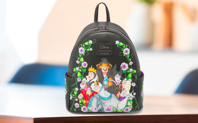 Disney Villains Loungefly Mini Backpack on a Table