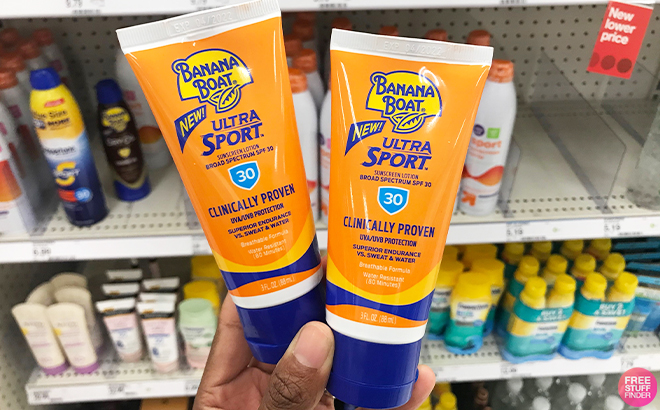 Hand Holding Two Banana Boat SPF 30 Sunscreens 3 Ounce