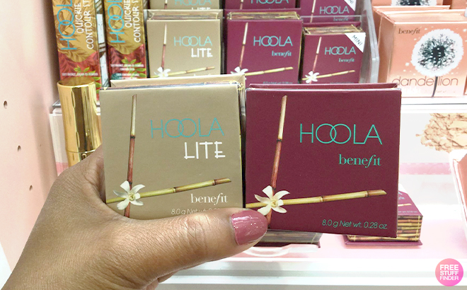 Hand Holding Two Benefit Cosmetics Hoola Matte Bronzers