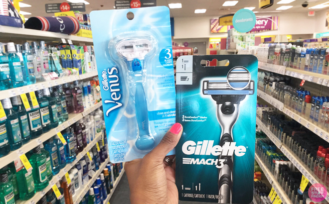 Hand holding Gillette Mach3 Razor and Gillette Venus Smooth Razor