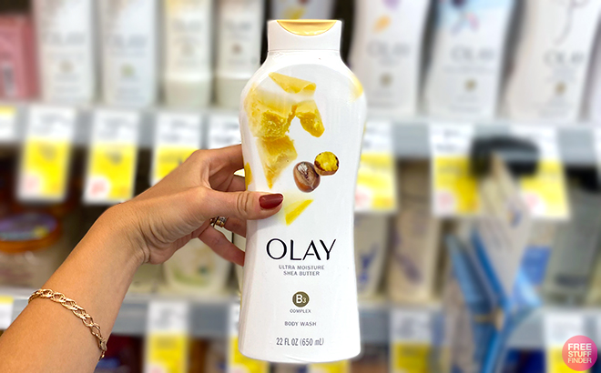 Hand holding one Olay Ultra Moisture Body Wash Shea Butter 22 Ounce