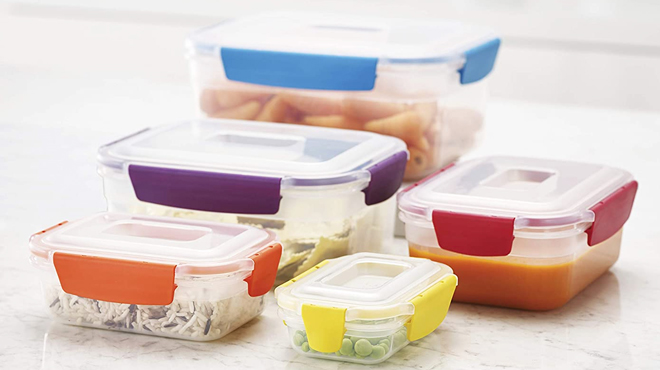 Joseph Joseph Nest Lock Plastic BPA Free 10 Piece Food Storage Container Set Filled with Food on a Marble Kitchen Top