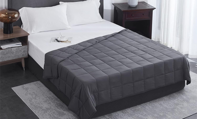 Weighted Blanket in Dark Gray on a Bed