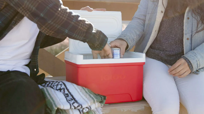 Woman and Man Getting Drink from the Igloo 9 Quart Laguna Ice Chest Cooler