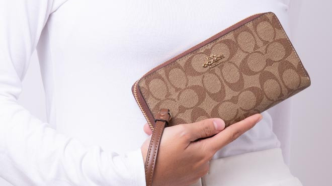 Woman holding Coach Wallet