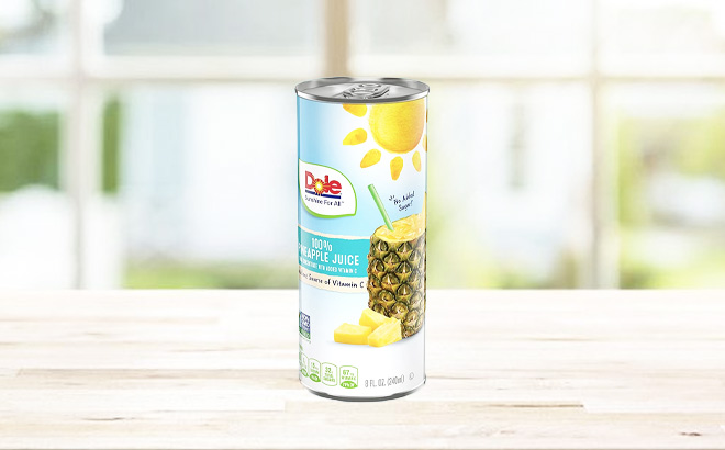 A Can of Dole 100% Pineapple Juice on a Table