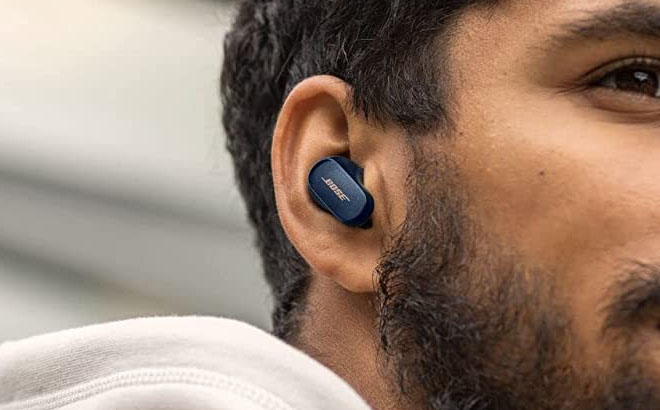 A Man Using Bose QuietComfort Earbuds