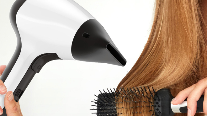 A person using Remington Ceramic Hair Dryer