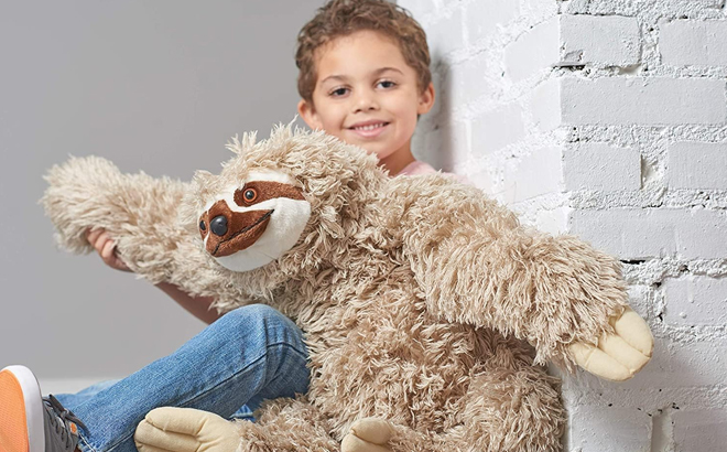 Boy Playing with Wild Republic 30 Inch Jumbo Cloth Plush