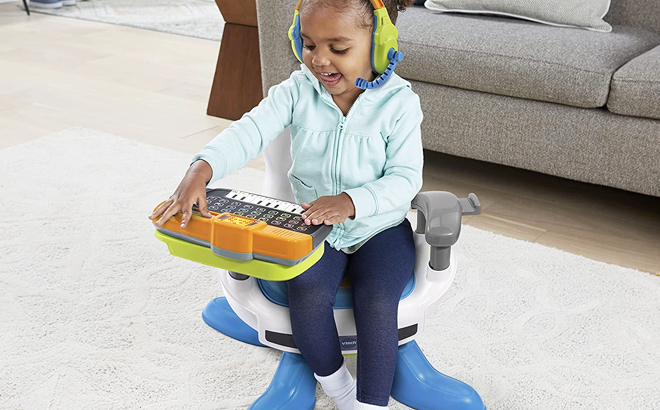 Girl playing with the Vtech Level Up Gaming Chair