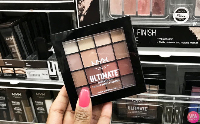 Hand Holding NYX Ultimate Shadow Palette