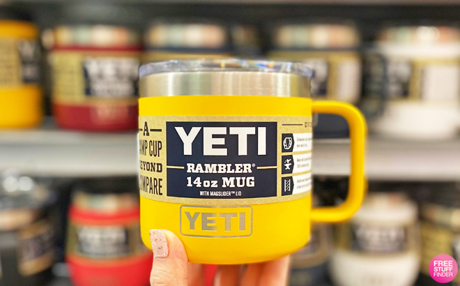 Hand Holding a Yeti Rambler Mug in Yellow