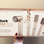 Hand Holding the Box of Shark FlexStyle Hair Dryer Styler