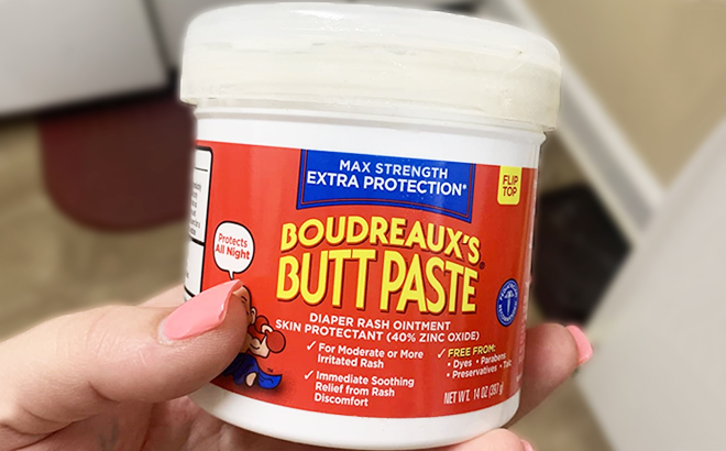 A Hand Holding Boudreauxs Butt Paste Maximum Strength Diaper Rash Cream