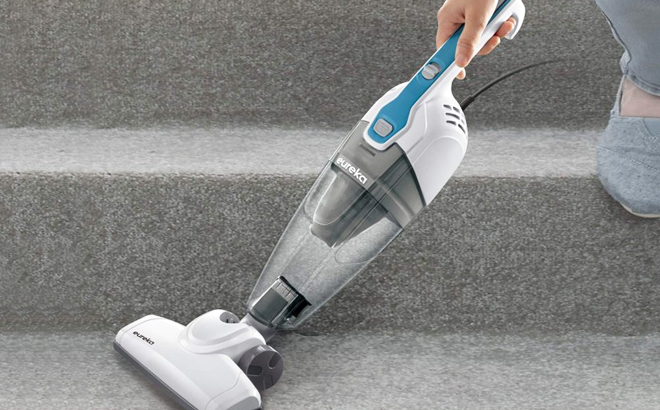 A Hand Holding Eureka 3 in 1 Handheld Stick Vacuum